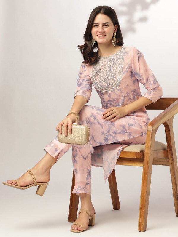 Peach silk kurta and pants set with spiral dyeing and embroidery on the yoke